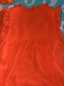 Orange Smocked Ruffle Tank