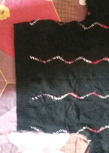 Cozy Black Knit Sweater with Wavy Trim