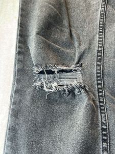 Distressed grey jeans