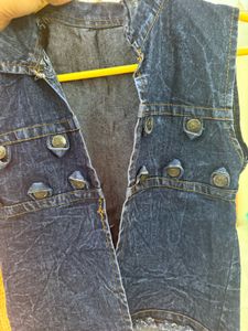 Denim vest with decorative buttons