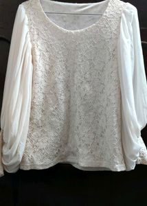 white top with heavy balloon sleeves