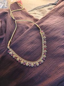 Elegant Gold-Tone Necklace with Red Accents