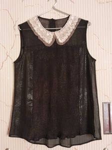 Black sleeveless blouse with lace collar