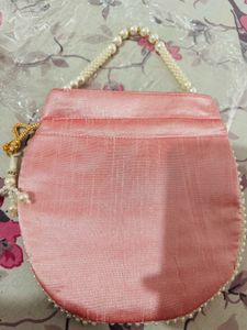 Regal Pink Pearl Potli Bag with Embellished Handle