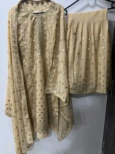 Elegant Cream Embroidered Garara Suit.