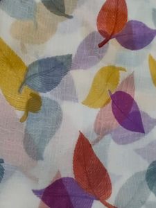 White Color Saree Colorfull Leaves Design. Georget Material.