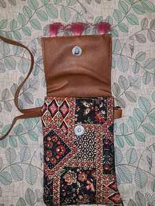 Vibrant Multicolored Sling Bag with Pink Tassels