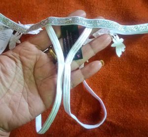 Unisex Lacy White Thong with Charm