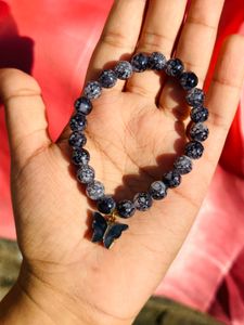 Black Printed Beads Bracelet With Hanging Charm.