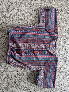 Patterned top traditional goes with black skirt