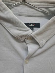 Long-sleeve polo shirt with a button-down collar.