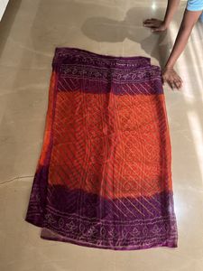 Lovely orange and purple bandhej Saree