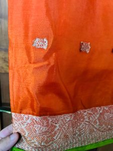 orange colour silk saree with green mundani