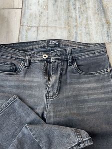 Distressed grey jeans