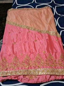It Is Pink Color Georget With Golden Net Border .