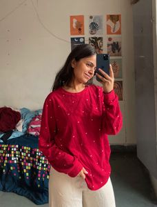 Red embellished top