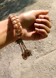 Elegant Pearl Bangle with Tassels