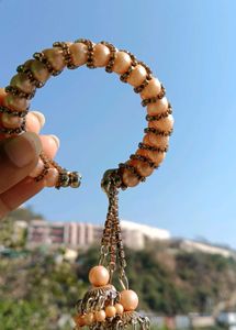 Elegant Pearl Bangle with Tassels