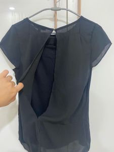 Chic Black Blouse with Embellished Detail