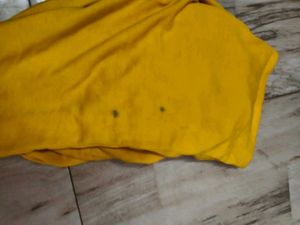 Yellow T-shirt with stains
