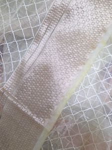 Elegant Cream Net Saree
