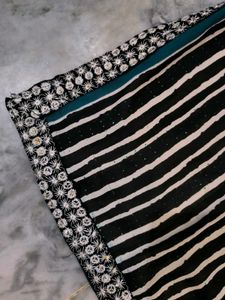 Green,red,black and white standard saree.