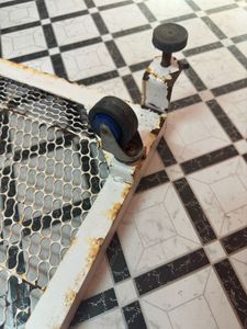 Vintage Metal Mesh Rolling Washing Machine Stand.