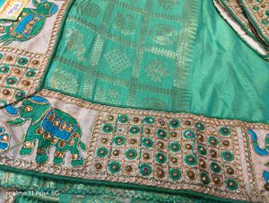 Elegant Green Silk Saree with Elephant Border