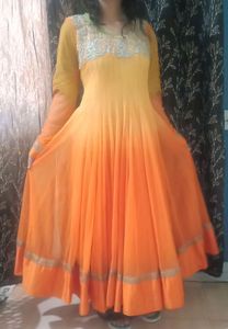 A very pretty orange and yellow double shaded full flayar anarkali with chudidar and pretty orange dupatta