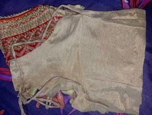 Red Heavy Saree With Golden Blouse.