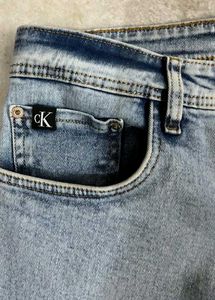 CALVIN KLIEN ICE WASHED BLUE BOOTCUT JEANS 32