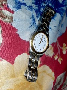 A gold and silver shining tissot watch