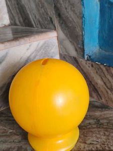 A Small Yellow Smiley Piggy Bank