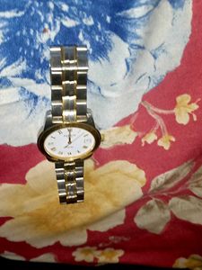 A gold and silver shining tissot watch