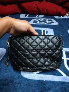 Black Quilted Carrot Sling Bag