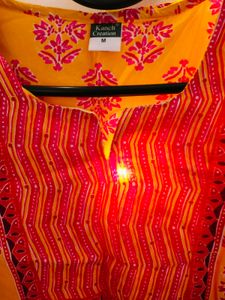 A Yellow Floral Print Tunic For Women
