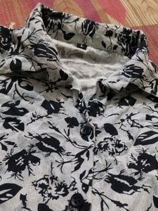 It Is A Shirt With Navy Blue Flowers