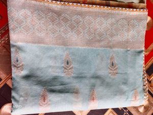 Elegant Aqua Saree with Intricate Paisley Detail