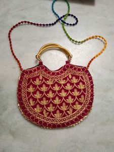 Red,rani pink, and purple Embroidered Clutches
