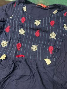 Embroidered peplum top