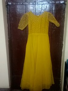 Beautiful Mustard Gown With Netted Layer