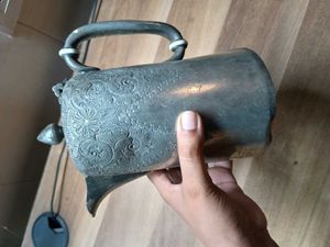 silver-plated pitcher or teapot