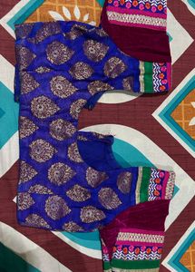 Orange Saree with Colorful Embellishments