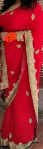 Shiffon bright red partywear saree, golden stone