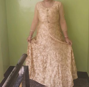 Nude Floral Gown With Cancan Styled Wit Stone Work