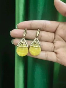 White Earrings Amd Golden Jhumkas.