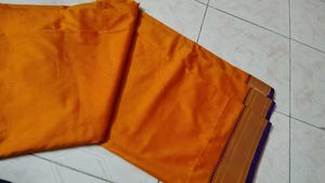 Mustard color saree with purple border and blouse