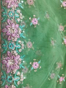 shimmery green two way net and Georgette saree