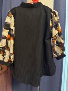 Unique Black Blouse with Patterned Sleeves