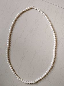 Off White Diamond Jhumkass With Malaa